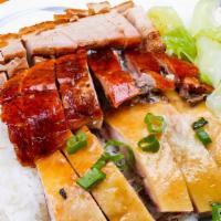 Cantonese Triple Delight 鸡鸭叉烧饭 · Cantonese style Bbq, three slices of meat chicken roasted duck and honey roasted pork with s...