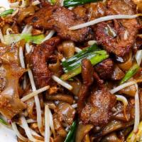 Beef Chow Fun 干炒牛河 · Stirred fried flat chow fun noodles with beef onions sprouts.
