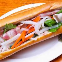 Classic Vietnamese Sandwich  越南面包 · Three Vietnamese slices of meat, daikon radish, carrots, cucumber, and cilantro. Served with...