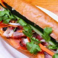 Roasted Pork Sandwich  叉烧面包 · Honey roasted pork, daikon radish, carrots, cucumber, and cilantro. Served with special swee...