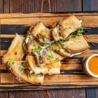 Grilled Cheese · sourdough, American & cheddar cheese, caramelized onions, hot honey drizzle