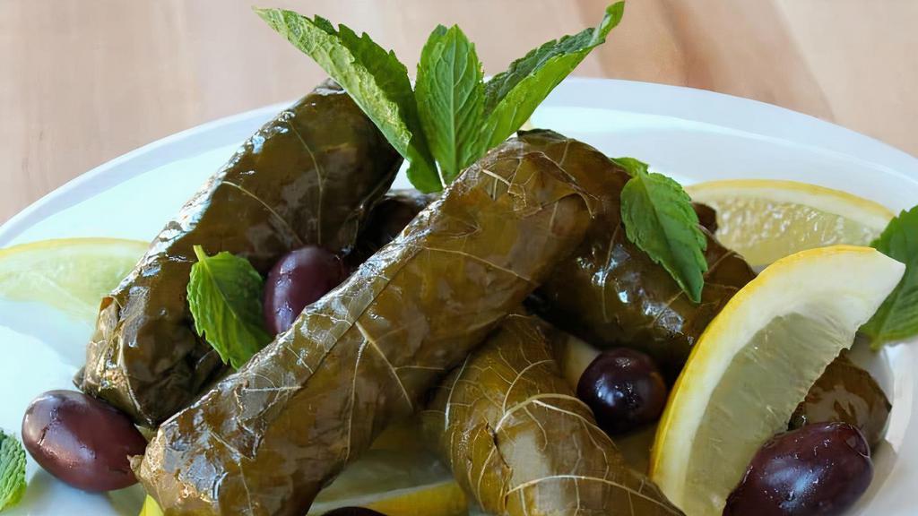 Grape Leaves · Grape leaves stuffed with rice, dry mint, black pepper, and onions.