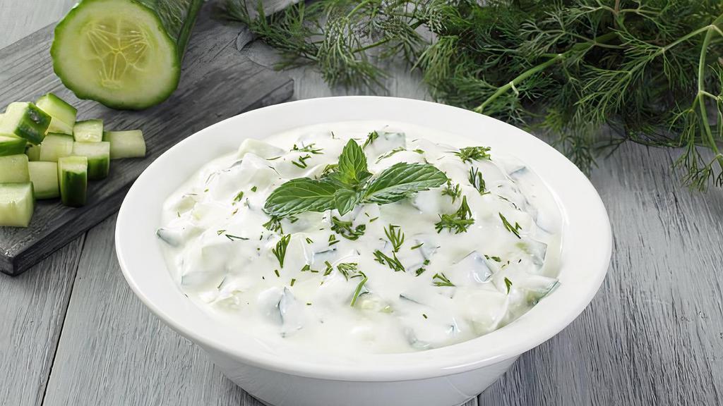 Cacik · A lasly dip of yogurt made with cucumber, salt, garlic, and mint.