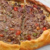 Cheese & Ground Meat Pide · Flatbread topped with ground meat spices and Turkish kasher cheese.