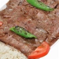  Lamb Gyro · Thinly sliced ground lamb seasoned with a mixture of Turkish spices and served with rice and...