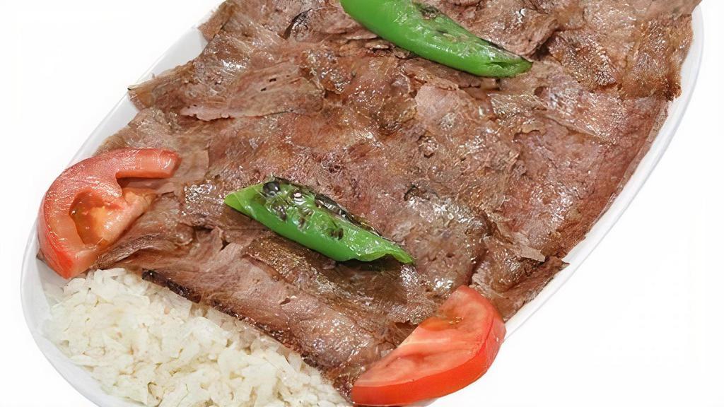  Lamb Gyro · Thinly sliced ground lamb seasoned with a mixture of Turkish spices and served with rice and salad.