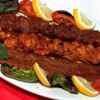 Mix Adana Kebab · Char-grilled chicken and lamb skewers seasoned with Turkish spices and served with rice and ...