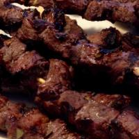 Beef Shish Kebab · Char-grilled marinated beef cubes served with rice and salad.