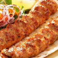 Chicken Adana Kebab · Char-grilled ground chicken seasoned with a module of Turkish spices and red pepper served w...