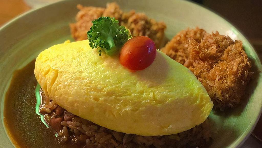 Omurice · Kurobuta sausage fried rice covered with soft velvety egg omelette, comes with miso soup.