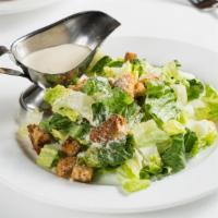 Insalata Di Cesare · Romaine lettuce, croutons, and Parmesan cheese. Caesar dressing on the side.