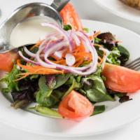 Insalata Mista · Mixed green salad with onions, tomatoes, and carrots. Lemon dressing served on the side.
