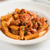 Rigatoni Con Salsiccia-Family Size · Rigatoni pasta, sausage, tomatoes, and garlic.