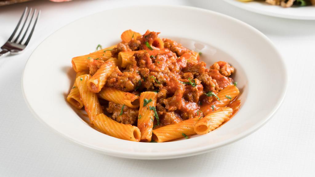 Rigatoni Con Salsiccia-Family Size · Rigatoni pasta, sausage, tomatoes, and garlic.