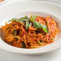 Spaghetti Pomodoro · Spaghetti with fresh tomato sauce and basil.