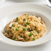 Risotto Con Funghi · Arborio rice with mushrooms and peas.