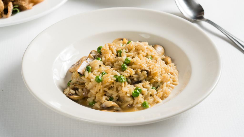 Risotto Con Funghi · Arborio rice with mushrooms and peas.