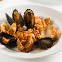 Risotto Alla Pescatora · Arborio rice with mixed seafood (shrimp, mussels, clams, and calamari) in red sauce.
