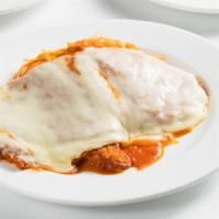 Pollo Parmigiana · Breaded chicken breast, topped with mozzarella and tomato sauce.