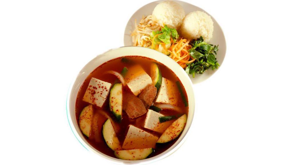 Tofu Soup · Beef soup with Korean hot sauce, spices, vegetables and tofu. Served with two scoops of rice and four vegetables.