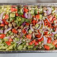 La Famiglia Salad · Chopped iceberg lettuce, chopped tomatoes, red onion, cucumbers, roasted peppers, olives, ch...