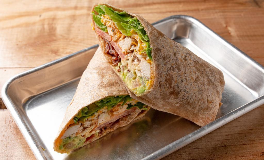 Chicken Royale Wrap · Breaded or grilled chicken, lettuce, tomato, shredded cheddar or Monterey jack cheeses, bacon, guacamole, and moo special sauce. White flour or whole wheat wrap