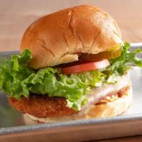 Hot Chix · Breaded chicken filet topped with melted Pepperjack cheese, tomato, lettuce, pickles and Caj...