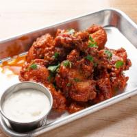 Chicken Wings (8) · NEW and improved. We now only use fresh organic wings, breaded in our own seasoned flour ble...