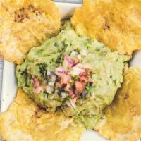 Guacamole Con Tostones · Guacamole served with green fried plantains.