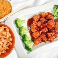 General Tsos Chicken · Spicy. Chunks of chicken soaked in egg white and fried, garnished with broccoli.
