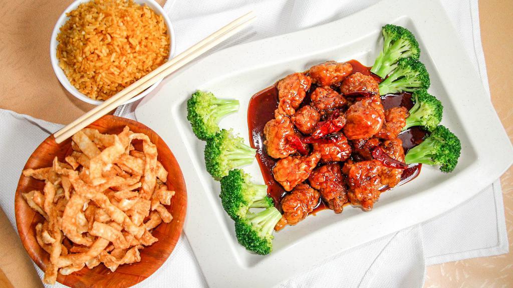 General Tsos Chicken · Spicy. Chunks of chicken soaked in egg white and fried, garnished with broccoli.