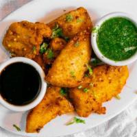 Pakoras · Fried fritters tossed in seasoned chickpea batter and deep fried.