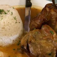 Osso Buco · Veal shank cooked in its own juice. Served over rice.