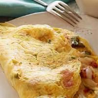 Western Omelet · Peppers, onions, tomatoes, ham, and Cheddar cheese.