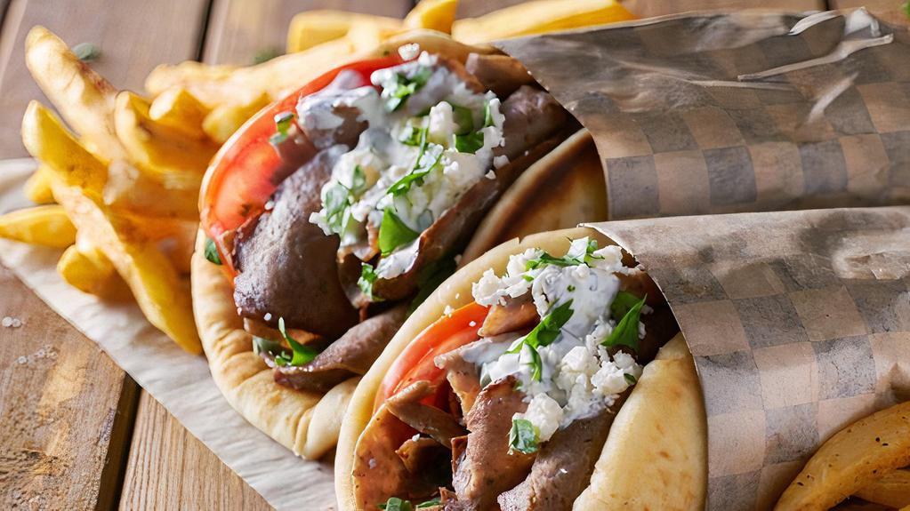 Falafel & Lamb Gyro · Crispy falafels and thinly sliced lamb meat, hummus, lettuce, tomatoes and onions wrapped in pita bread.