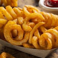 Curly Fries · Basket of curly fries.