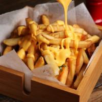 French Fries With Cheese · Basket of fries topped with melted cheese.