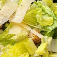 Caesar Salad · Crispy romaine lettuce, croutons, homemade Caesar dressing, topped with shaved Parmesan chee...