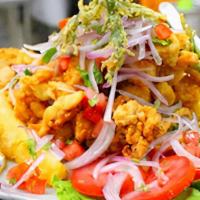 Jalea Mixta / Fried Seafood · Mariscos fritos con yuca frita y ensalada criolla / Served with fried cassava and salad