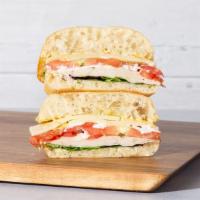 Roasted Turkey · Sliced roasted turkey with sliced tomato, mixed greens, swiss cheese, dijon mustard, and aio...