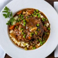 Veal Osso Buco · Braised, slow cooked cabernet sauce w/mushrooms & peas over risotto or mashed potato.