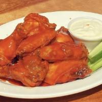 Wings · 8 wings covered in choice of Buffalo, Teriyaki, BBQ, or Sweet Heat sauce.  Includes bleu che...