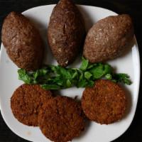 Fried Kibbeh (3) · Sautéed lamb, onions and pine nuts into cracked wheat and ground lamb. Fried to perfection.
