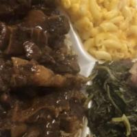 Oxtail · Oxtails Over Rice With Your Choice Of 2 Sides & Corn Bread.