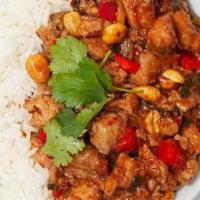 Spicy Kung Pao Chicken Bowl · Tender chicken that is cooked in a sweet and spicy szechuan chili-soy sauce, served on jasmi...