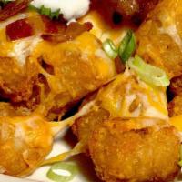 Tiny Tater Tots Unloaded · golden potato nuggets, mozzarella-cheddar blend,
topped with sour cream and scallions