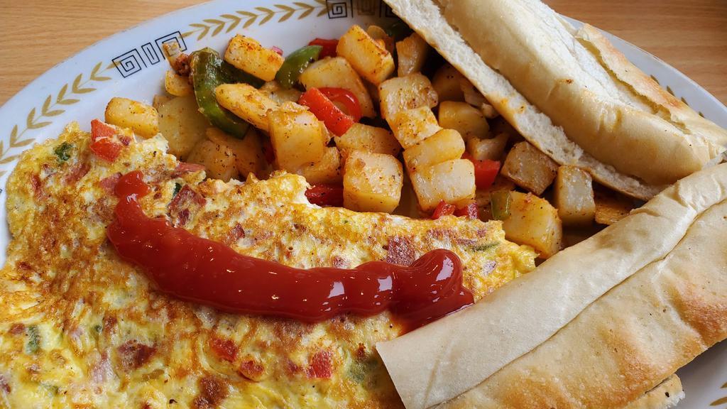 Havana Omelette Breakfast · omelette with chorizo, ham, peppers, onions and cheese, served with cuban buttered toast and home fries.