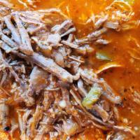 Ropa Vieja (Shredded Beef) · shredded beef in a delicious red sauce with peppers onions and garlic.