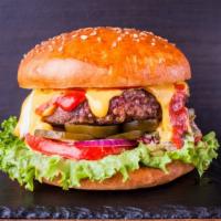 Cheeseburger Deluxe · Juicy beef patty with your choice of cheese, lettuce, tomato, mayonnaise, and ketchup on a f...