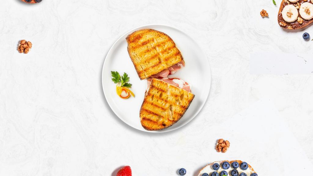 Return Of The Turkey Panini · Sliced turkey, melted cheese, and tomato on your choice of toasted bread.